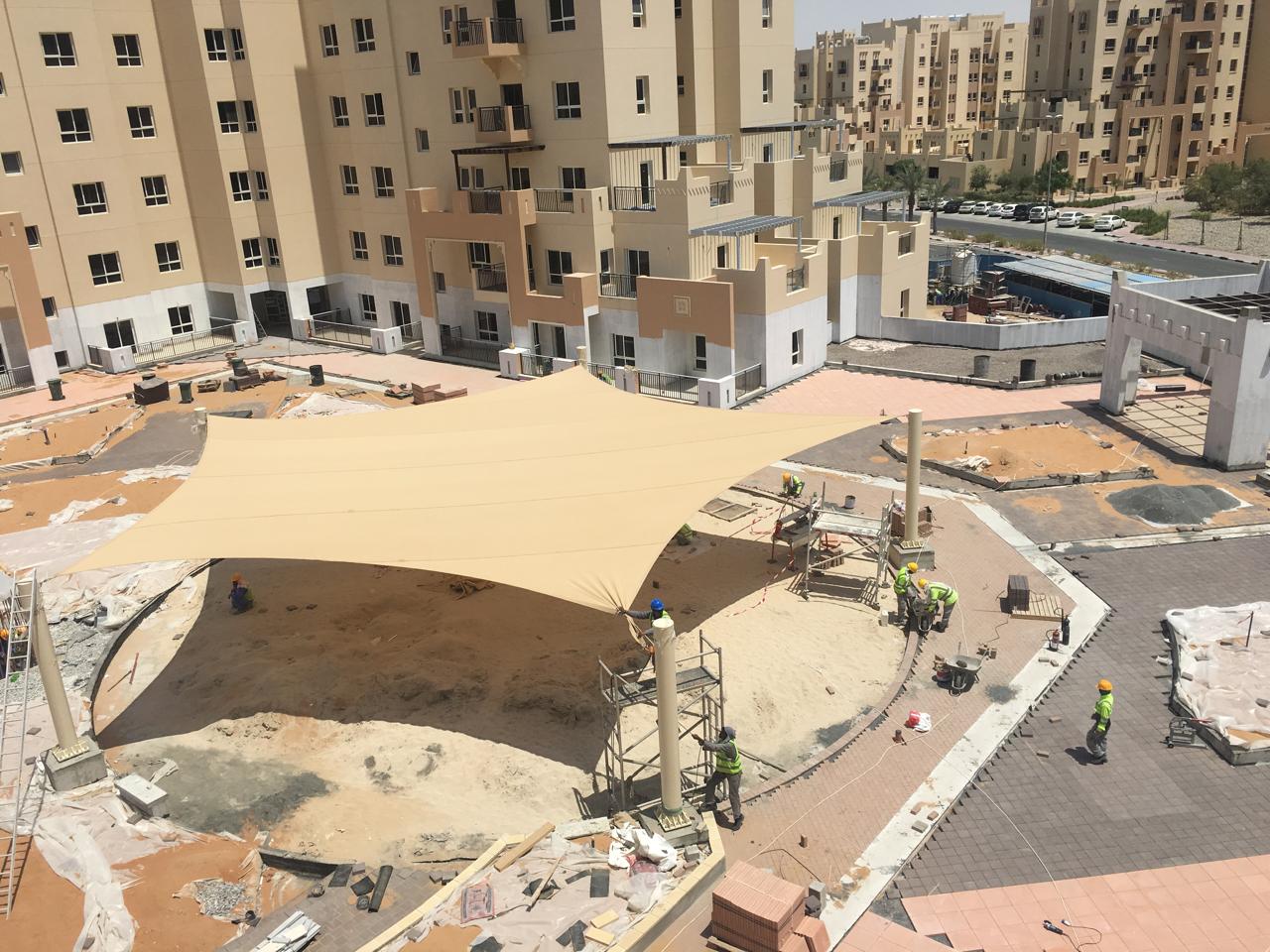 AZOV team performing quality inspection on shade structure in Sharjah